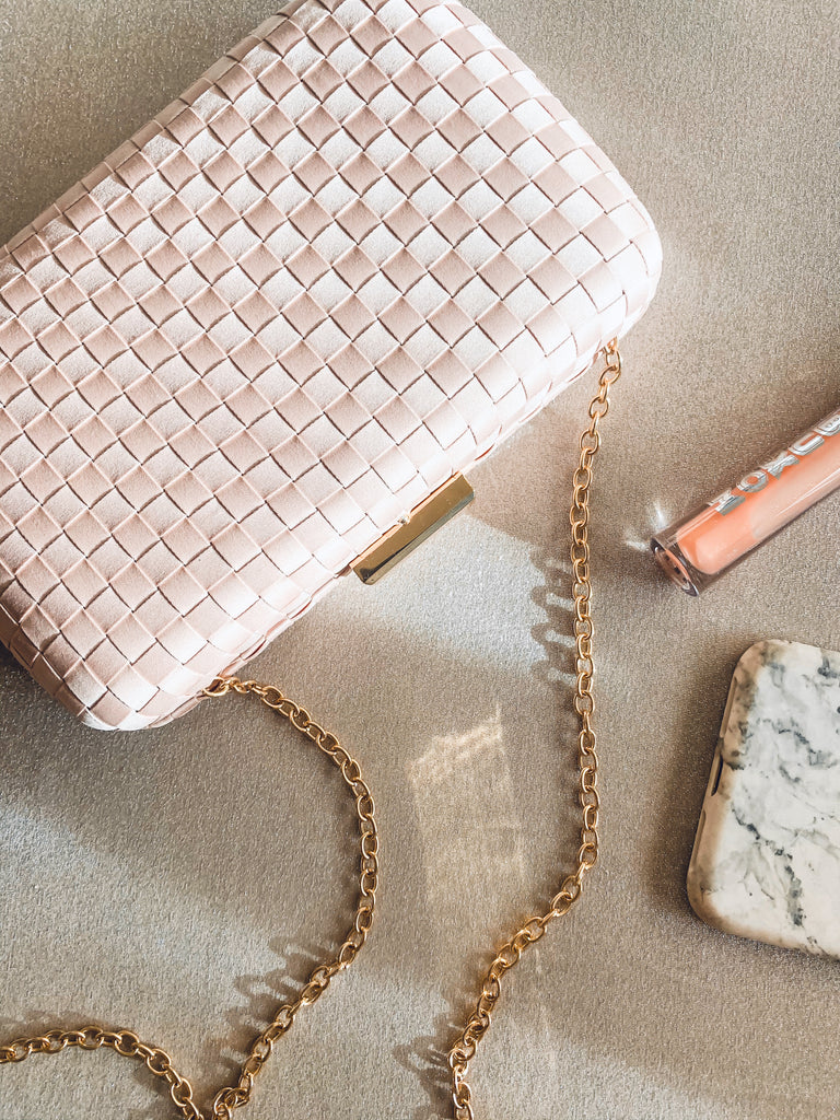 blush clutch with gold chain